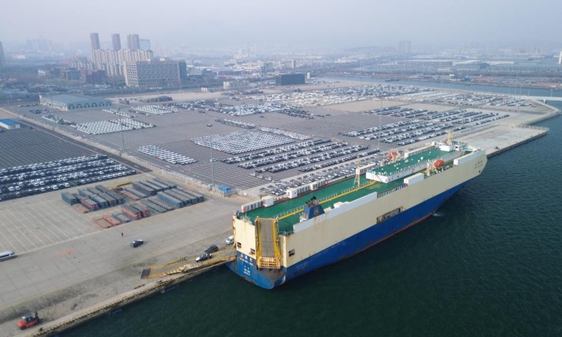 An aerial drone photo taken on Jan. 16, 2024 shows vehicles at a terminal of Dalian Port, northeast China's Liaoning Province. Dalian Port achieved a record-breaking annual export of 102,773 vehicles in 2023, marking a year-on-year growth of 143 percent, according to the Dalian Customs.(Photo: Xinhua)
