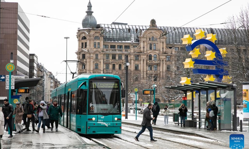 People and a tram are seen after snow in Frankfurt, Germany, Jan. 18, 2024. Snow fell in Frankfurt on Thursday.(Photo: Xinhua)