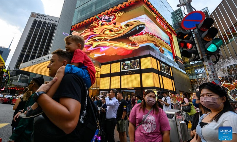 This photo taken on Jan. 19, 2024 shows video clips of 3D dragon in celebration of the upcoming Chinese zodiac Year of the Dragon on the LED screen outside a shopping mall in Kuala Lumpur, Malaysia. (Photo by Chong Voon Chung/Xinhua)