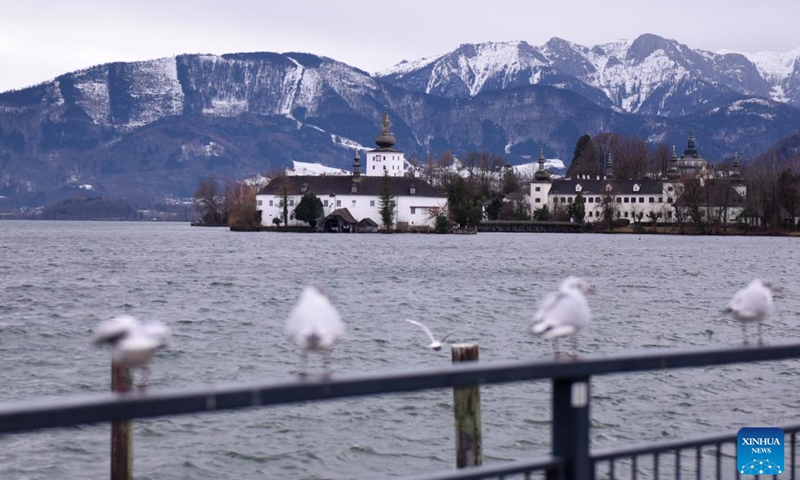 This photo taken on Jan. 18, 2024 shows Schloss Ort and Lake Traunsee at Gmunden in Austria. Bad Ischl Salzkammergut has been awarded as The 2024 European Capital of Culture. (Xinhua/He Canling)