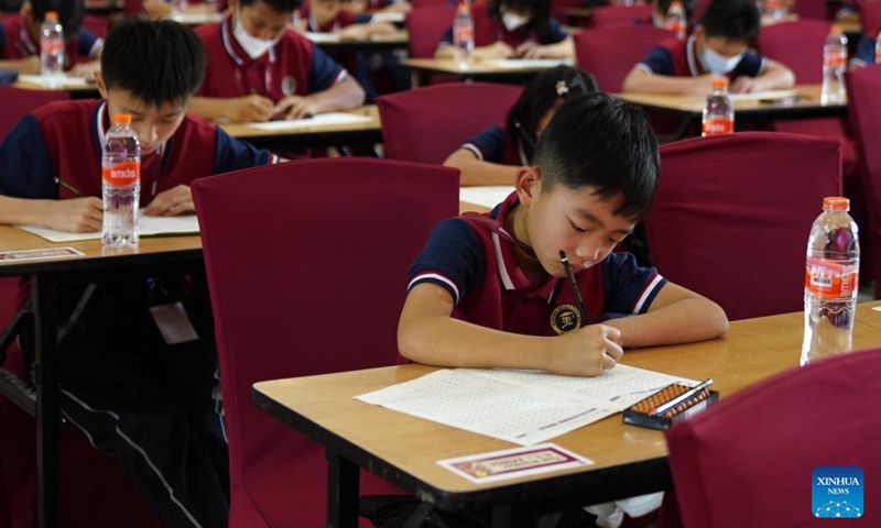 Contestants compete in the Third Indonesia Shenmo Cup International Abacus Mental Arithmetic Competition in Bandung, West Java, Indonesia, Jan. 20, 2024. The event kicked off on Saturday with nearly 200 children competing in this year's competition. (Xinhua/Ma Ning)