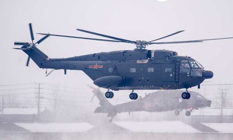 Helicopters attached to a brigade under the PLA 71st Group Army lift off successively after snow on February 20, 2024. The training mission aimed to beef up the pilots' rapid response and special situation handling capabilities. (eng.chinamil.com.cn/Photo by Li Jingyou)