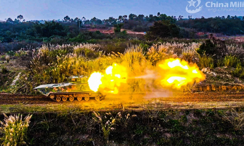 An armored vehicle attached to an armored detachment with an amphibious combined-arms brigade under the PLA 73rd Group Army fires at simulated targets during a shooting assessment in mid-February, 2024. The assessment focused on such subjects as crew coordination, firing during transient stop, and firing on the move, in order to test the combat effectiveness and precision strike capability of the troops. (eng.chinamil.com.cn/Photo by Liu Hao)