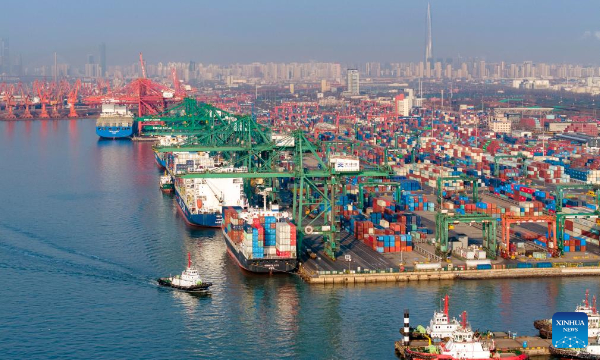 An aerial drone photo taken on Feb 2, 2024 shows container vessels berthing at a container terminal of Tianjin Port in north China's Tianjin. Tianjin Port, located on the coast of the Bohai Sea, is a major shipping point in north China. Photo:Xinhua