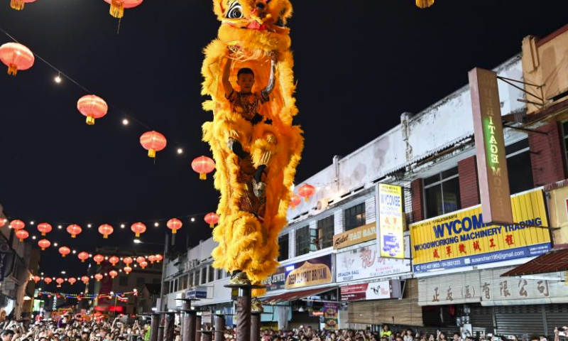 Artists perform lion dance during the Penang Chinese New Year Celebration in George Town, Penang, Malaysia, Feb. 18, 2024. (Photo by Xu Xinyu/Xinhua)
