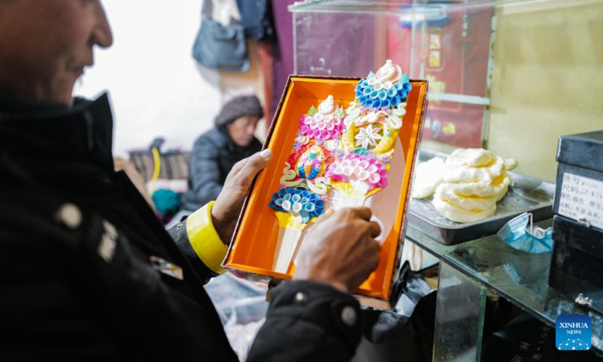 A craftsman makes butter sculptures in Lhasa, southwest China's Xizang Autonomous Region, Feb 7, 2024. The Tibetan New Year coincides with the Lunar New Year, or the Spring Festival, which falls on Feb 10 this year. As the New Year is approaching, butter sculptures handmade by local craftsmen sell quite well in Xizang. Photo:Xinhua