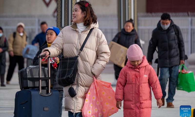Passengers are pictured at Xigaze Station in Xigaze, southwest China's Xizang Autonomous Region, Jan. 27, 2024. China officially ushered in its largest annual population migration on Friday, 15 days ahead of the Spring Festival, or the Lunar New Year, with record-breaking journey numbers expected. (Photo by Tenzin Norbu/Xinhua)