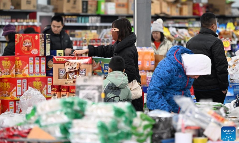 People select products during a fair in preparation for the upcoming Spring Festival in north China's Tianjin, Jan. 28, 2024. (Xinhua/Li Ran)