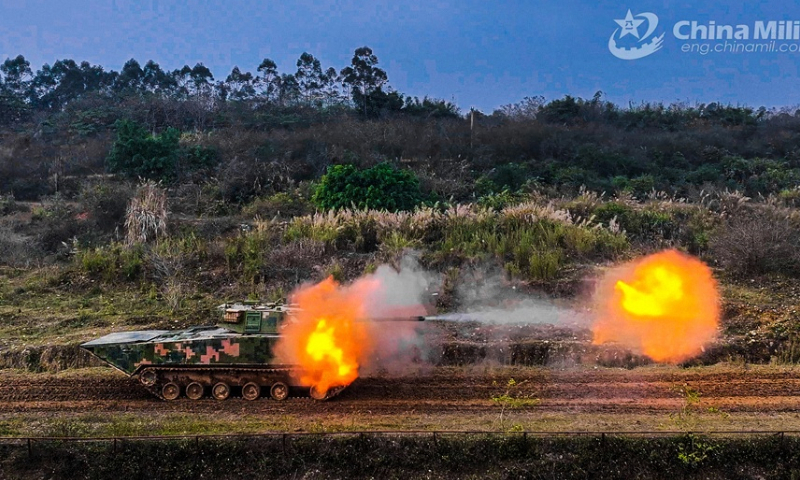 An armored vehicle attached to an armored detachment with an amphibious combined-arms brigade under the PLA 73rd Group Army fires at simulated targets during a shooting assessment in mid-February, 2024. The assessment focused on such subjects as crew coordination, firing during transient stop, and firing on the move, in order to test the combat effectiveness and precision strike capability of the troops. (eng.chinamil.com.cn/Photo by Liu Hao)