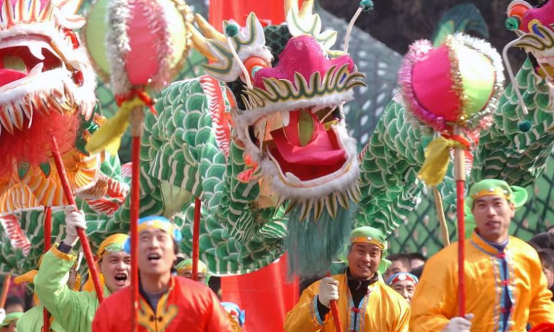Farmers take part in a Shehuo folk performance in Xigu District of Lanzhou, northwest China's Gansu Province during the Spring Festival in 2004.