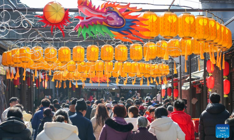 Tourists visit the Baohua mountain national forest park in Jurong City, east China's Jiangsu Province, Feb. 12, 2024. (Photo by Zhong Xueman/Xinhua)