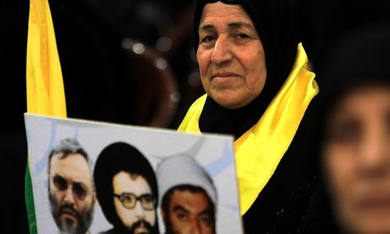 A supporter listens to a speech of Hezbollah leader Sayyed Hassan Nasrallah in the southern suburb of Beirut, Lebanon, on Feb. 16, 2024. Nasrallah on Friday said Israel will pay a heavy price for killing women and children in airstrikes on Nabatieh and al-Sawaneh in southern Lebanon, local TV channel al-Manar reported. (Xinhua/Bilal Jawich)