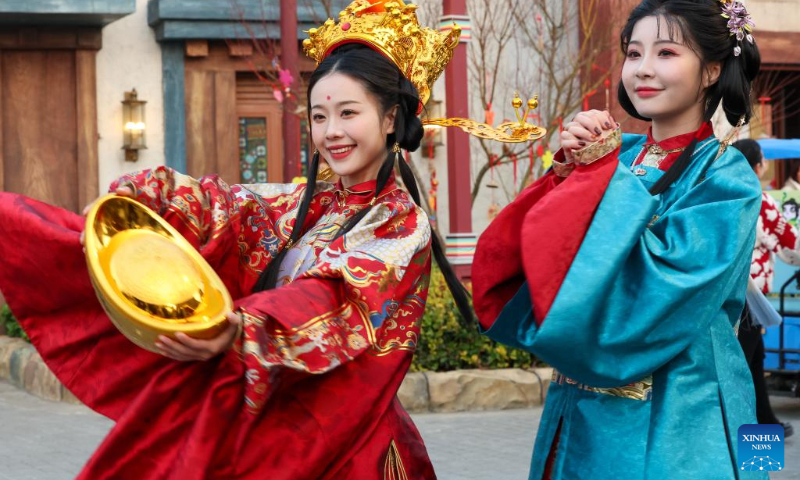 Tourists visit a scenic area in Xiangyang, central China's Hubei Province, Feb. 11, 2024. (Photo by Yang Dong/Xinhua)