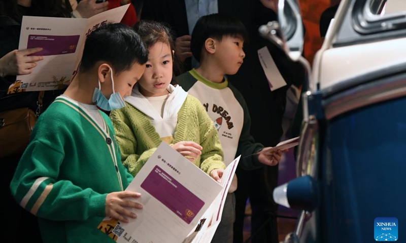 Children learn about automobile knowledge at Beijing Auto Museum in Beijing, capital of China, Jan. 28, 2024. Many children visit Beijing Auto Museum with their parents during this winter vacation to attend popular-science lectures and learn about automobile knowledge. (Xinhua/Ren Chao)