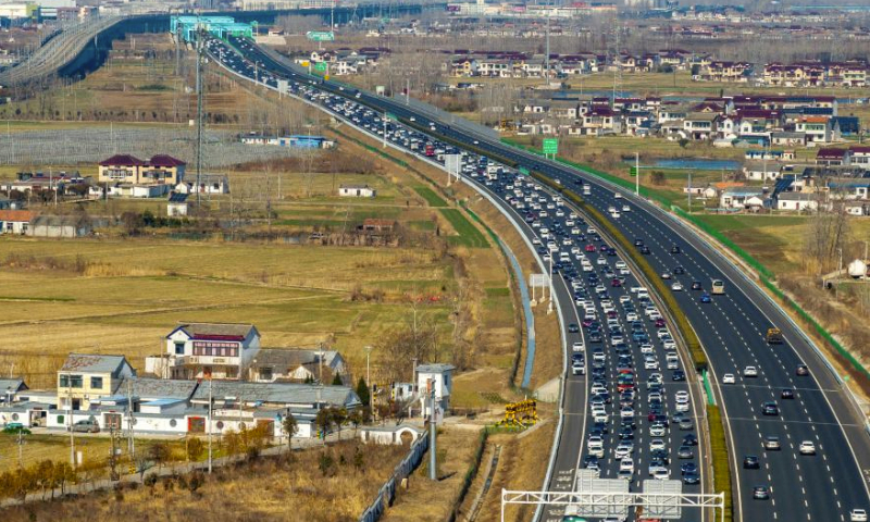 An aerial drone photo taken on Feb. 16, 2024 shows vehicles running on Beijing-Shanghai Expressway in Huaian, east China's Jiangsu Province. China witnessed an increase of passenger trips as this year's Spring Festival holiday is coming to an end. (Photo by He Jinghua/Xinhua)