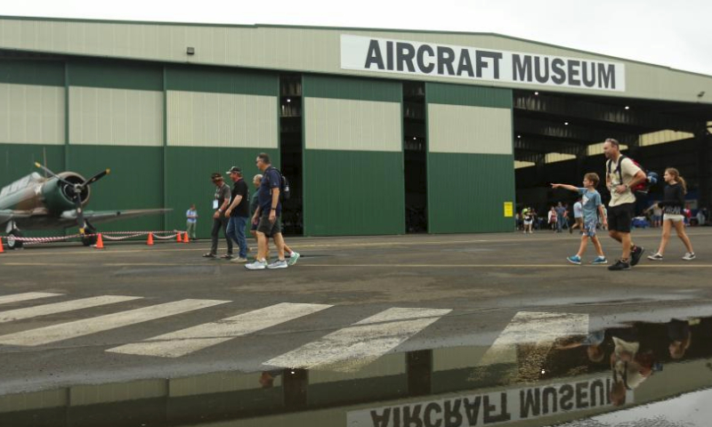 Visitors walk past the aircraft museum during the Airshow Downunder Shellharbour at Shellharbour Airport (formerly Illawarra Regional Airport), some 100km south of Sydney, Australia, March 2, 2024. The event, formerly known as Wings Over Illawarra, has been renamed Airshows Downunder Shellharbour. The brand new airshow takes place from March 1 to 3, 2024 and will be held every other year. (Xinhua/Ma Ping)