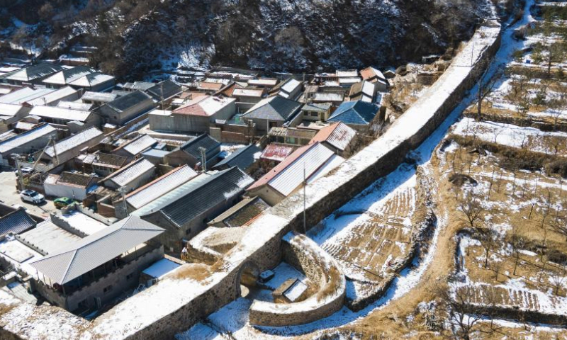 An aerial drone photo taken on Feb. 25, 2024 shows a city wall section and a barbican built in 1520 in Changyucheng Village, Changping District, Beijing, capital of China. Built in the Ming Dynasty (1368-1644), Changyucheng is an ancient Chinese village rich in historical and cultural resources. (Xinhua/Chen Zhonghao)