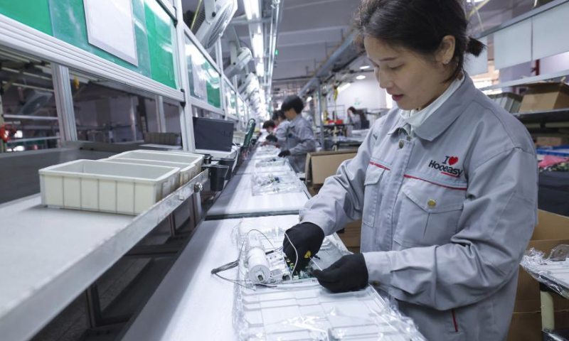 An employee works at an assembly workshop of Hooeasy Smart Technology Co., Ltd. in Jinhua City, east China's Zhejiang Province, Feb. 19, 2024. Factories across China have gradually resumed operations as the country's most celebrated holiday Spring Festival ends. (Xinhua/Xu Yu)