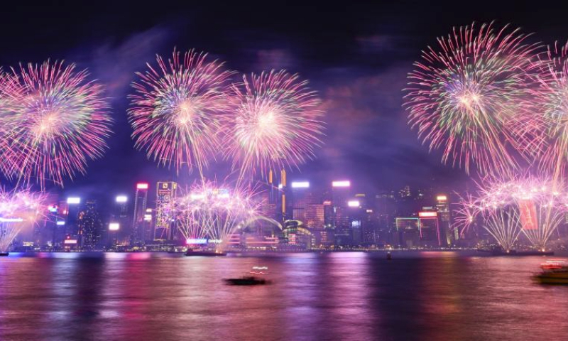 Fireworks in celebration of the Spring Festival illuminate the sky over Victoria Harbour in Hong Kong, south China, Feb. 11, 2024. (Xinhua/Zhu Wei)