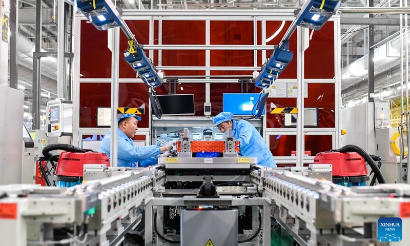 Staff members work at a battery production facility in Changchun, capital of northeast China's Jilin Province, Feb. 2, 2023.