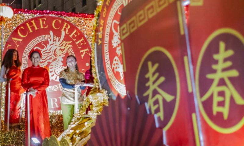 People on a float participate in a parade featuring Chinese New Year in San Francisco, the United States, Feb. 24, 2024. (Photo by Dong Xudong/Xinhua)