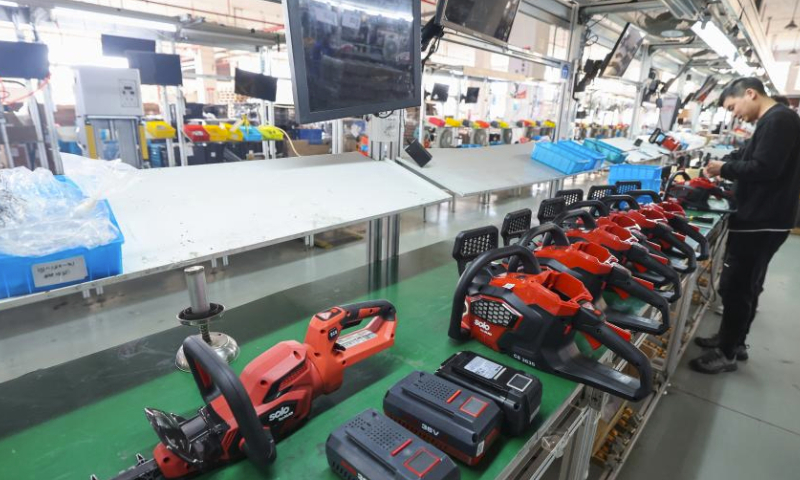 An employee works at a chainsaw assembly workshop of Sunseeker Industrial Co., Ltd. in Jinhua City, east China's Zhejiang Province, Feb. 19, 2024. Factories across China have gradually resumed operations as the country's most celebrated holiday Spring Festival ends. (Xinhua/Xu Yu)