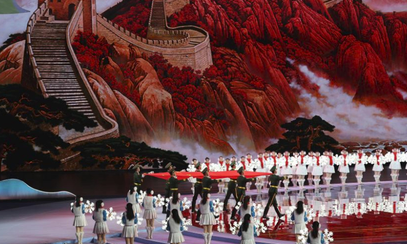 The Chinese national flag is carried to the stadium during the opening ceremony of the China's 14th National Winter Games in Hulun Buir, north China's Inner Mongolia Autonomous Region, Feb. 17, 2024. (Xinhua/Jiang Fan)