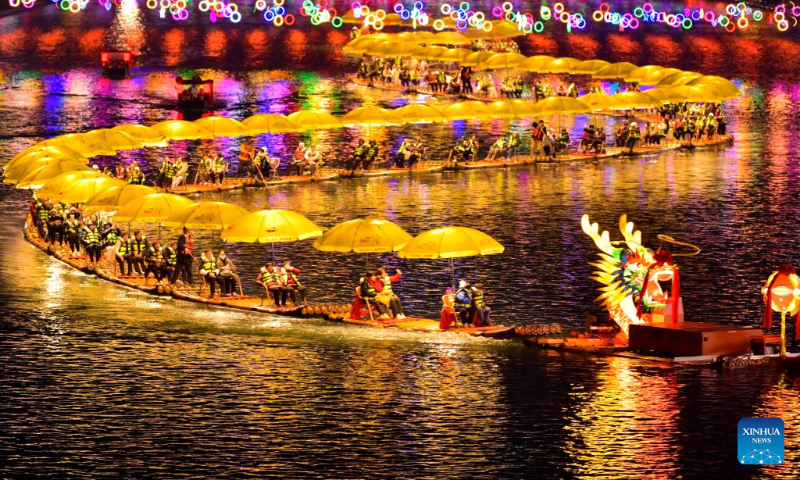 Tourists enjoy a night view in Xuan'en County, central China's Hubei Province, Feb. 11, 2024. (Photo by Song Wen/Xinhua)