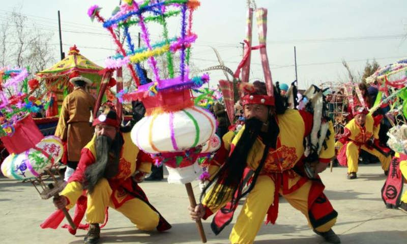 Villagers rehearse Shehuo folk performance in Yanguoxia Township of Yongjing County, Linxia Hui Autonomous Prefecture of northwest China's Gansu Province before the Spring Festival in 2014.