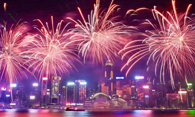 Fireworks in celebration of the Spring Festival illuminate the sky over Victoria Harbour in Hong Kong, south China, Feb. 11, 2024. (Xinhua/Zhu Wei)