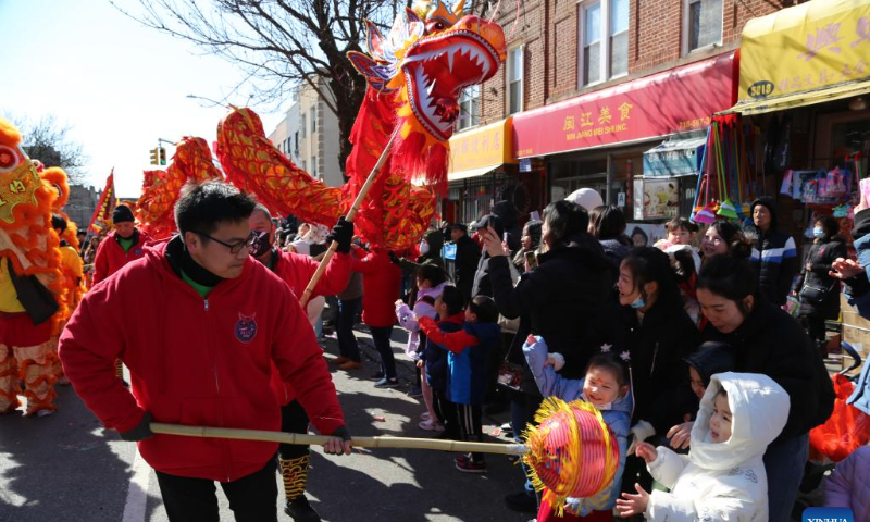People perform dragon dance and lion dance during a Lantern Festival parade in New York, the United States, Feb. 24, 2024. (Xinhua/Liu Yanan)