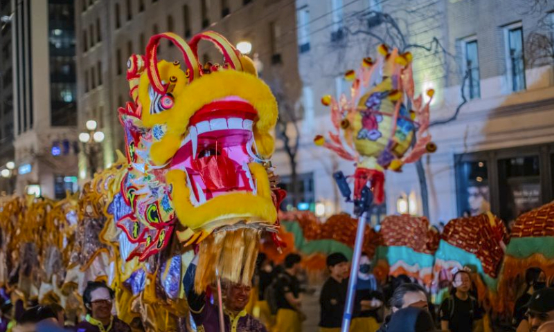 People perform dragon dance in a parade featuring Chinese New Year in San Francisco, the United States, Feb. 24, 2024. (Photo by Dong Xudong/Xinhua)