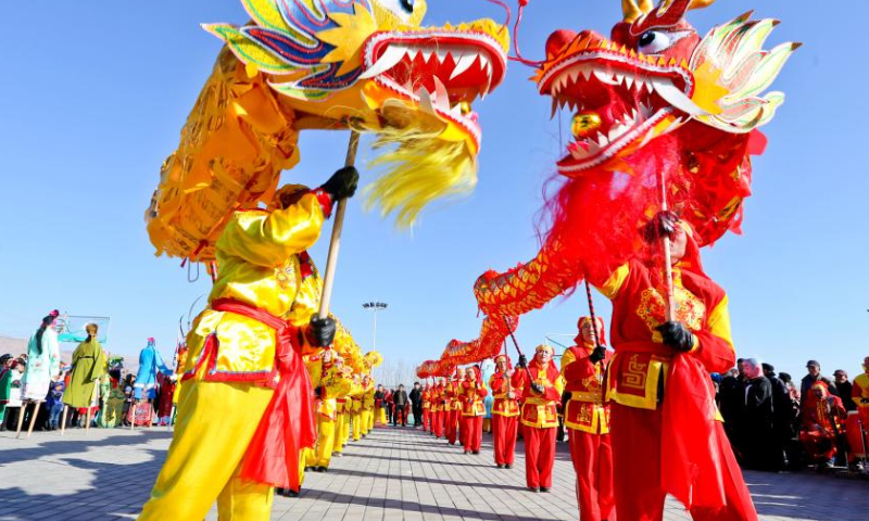 Members of a Shehuo folk performance team rehearse in Jing'an Town of Zhangye City, northwest China's Gansu Province before the Spring Festival in 2020.