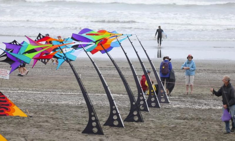 People fly kites during the 2024 Otaki Kite Festival held on the beach of Otaki, Wellington, New Zealand, Feb. 17, 2024. Hundreds of colourful kites were flying in the sky of Wellington's Otaki Beach during the kite festival held from Feb. 17 to 18. (Photo by Meng Tao/Xinhua)