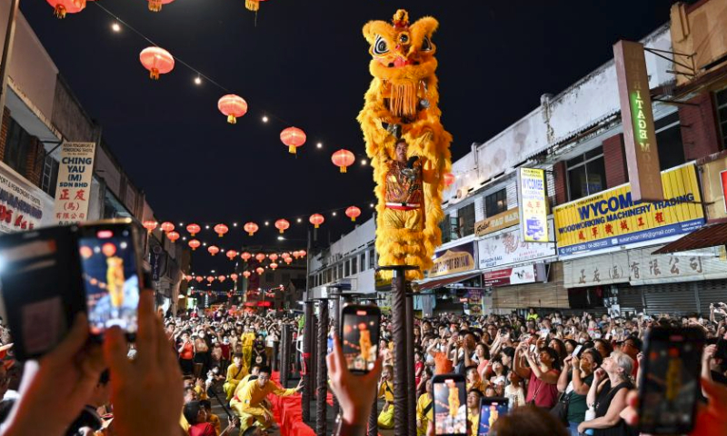 Artists perform lion dance during the Penang Chinese New Year Celebration in George Town, Penang, Malaysia, Feb. 18, 2024. (Photo by Xu Xinyu/Xinhua)