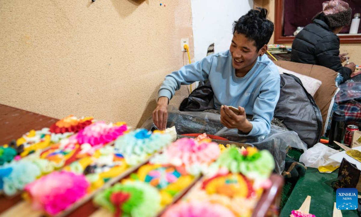 A craftsman makes butter sculptures in Lhasa, southwest China's Xizang Autonomous Region, Feb 7, 2024. The Tibetan New Year coincides with the Lunar New Year, or the Spring Festival, which falls on Feb 10 this year. As the New Year is approaching, butter sculptures handmade by local craftsmen sell quite well in Xizang. Photo:Xinhua