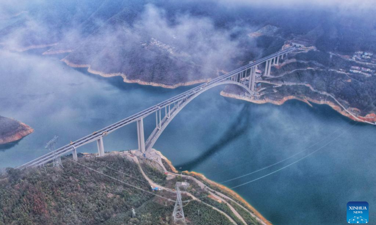 An aerial drone photo taken on Jan 31, 2024 shows the Tian'e Longtan Bridge in south China's Guangxi Zhuang Autonomous Region. Tian'e Longtan Bridge, a steel-reinforced concrete arch bridge over 600 meters long, opened to traffic on Thursday in south China's Guangxi Zhuang Autonomous Region. Photo:Xinhua