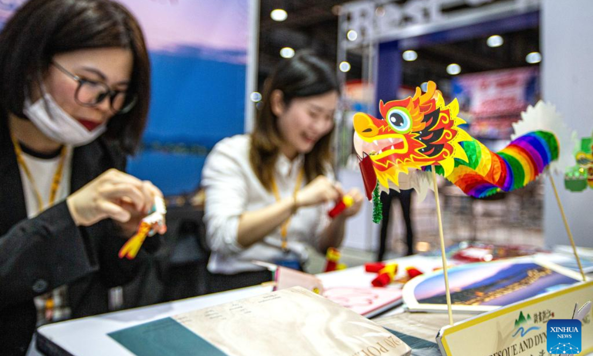 Staff members are seen at the booth of China's Zhejiang Province during the 29th Thailand International Travel Fair in Bangkok, Thailand, Jan 25, 2024. The fair kicked off here on Thursday and will last until Jan 28. Photo:Xinhua