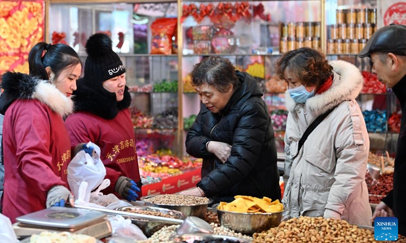 People select products during a fair in preparation for the upcoming Spring Festival in north China's Tianjin, Jan. 28, 2024. (Xinhua/Li Ran)