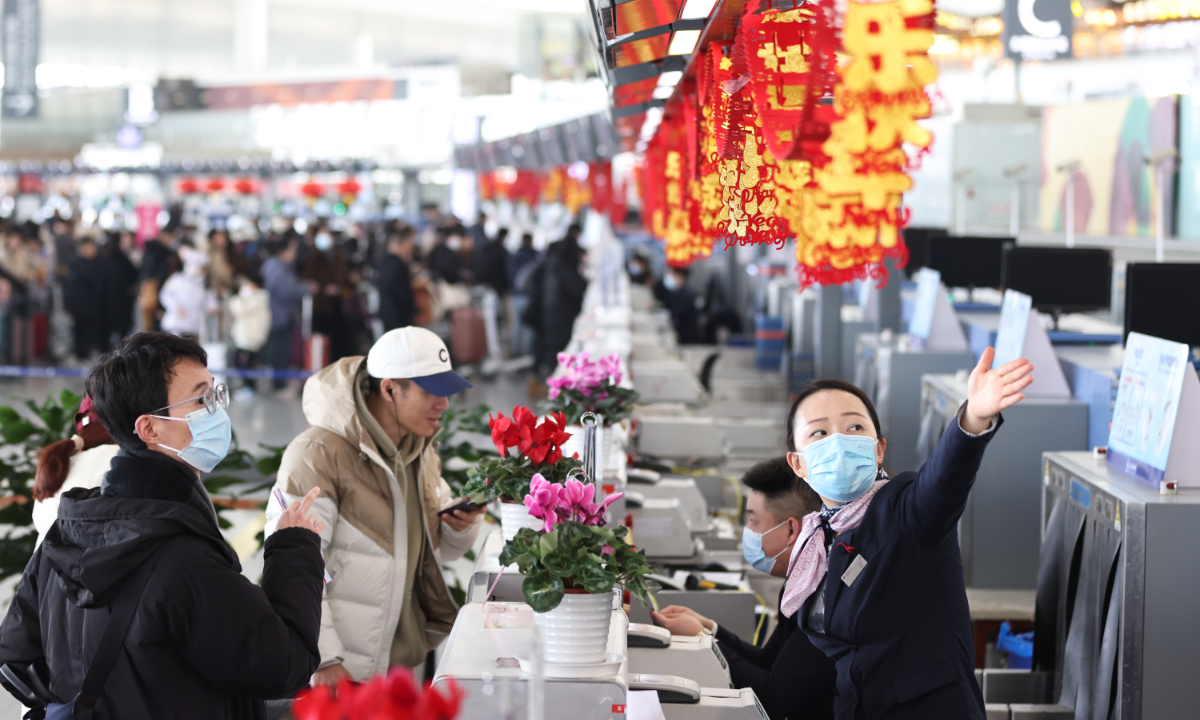 Passengers check in at the Nanjing Lukou International Airport in Nanjing, capital of East China's Jiangsu Province on February 8, 2024. As the Chinese Lunar New Year approaches, civil aviation is experiencing a peak in passenger flow. Photo: VCG