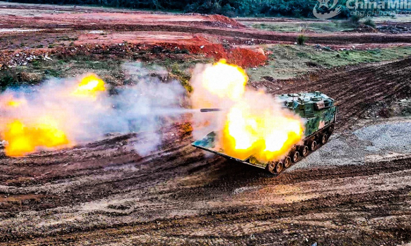 An armored vehicle attached to an armored detachment with an amphibious combined-arms brigade under the PLA 73rd Group Army fires at simulated targets during a shooting assessment in mid-February, 2024. The assessment focused on such subjects as crew coordination, firing during transient stop, and firing on the move, in order to test the combat effectiveness and precision strike capability of the troops. (eng.chinamil.com.cn/Photo by Liu Hao)