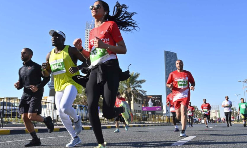 Runners participate in the Kuwait Marathon in Kuwait City, Kuwait, March 2, 2024. (Photo by Asad/Xinhua)
