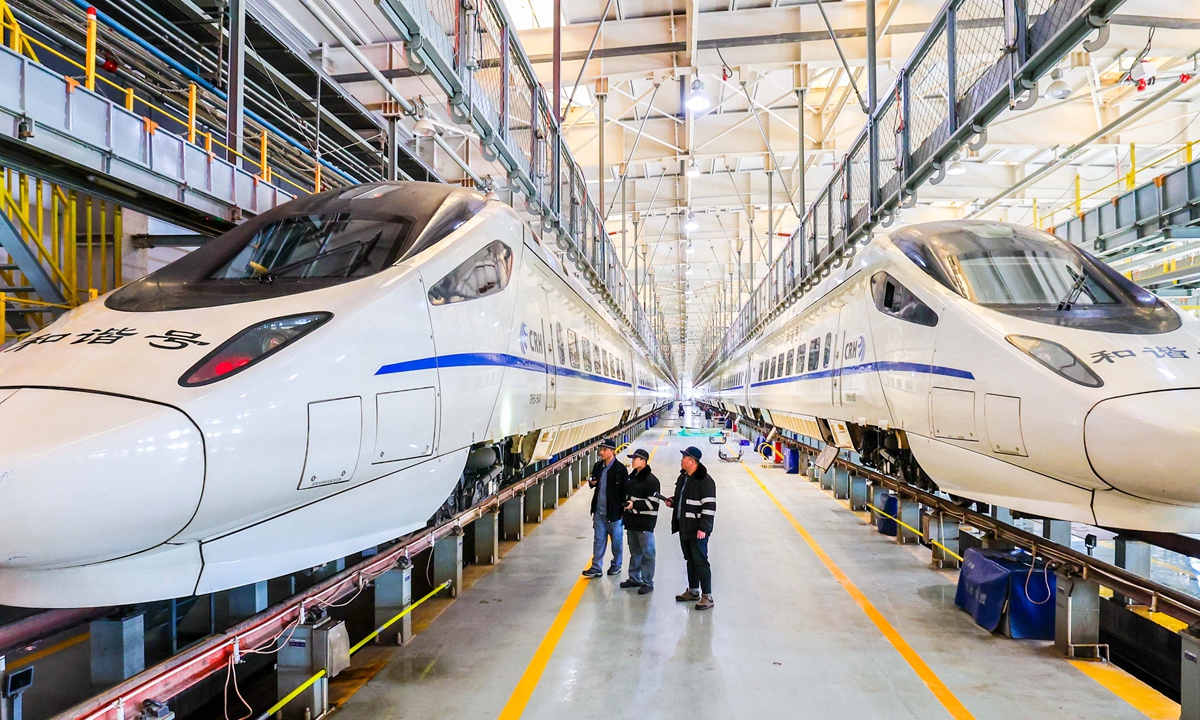 Technicians check the trains in a station in Hohhot, Northeast China's Heilongjiang Province on January 23, 2024. As the Spring Festival is approaching, staffers are conducting various inspections to ensure the safety of train operations during the 40-day travel rush. Photo: VCG