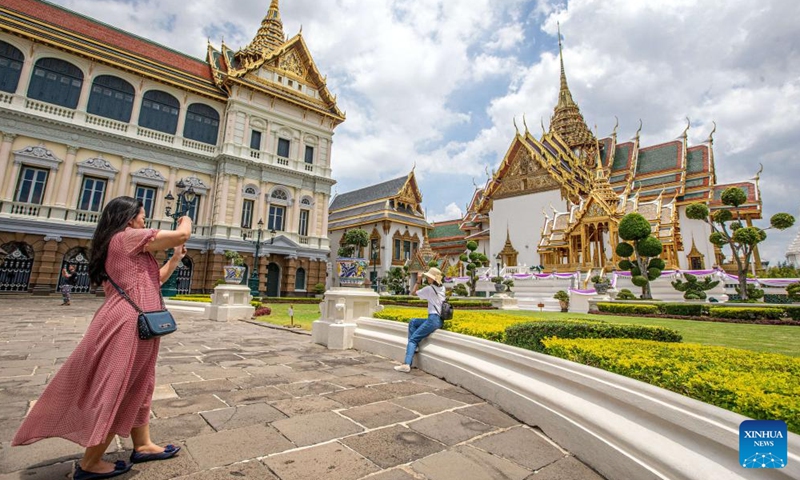 Tourists take photos at the Grand Palace scenic spot in Bangkok, Thailand, June 15, 2023.File Photo:Xinhua