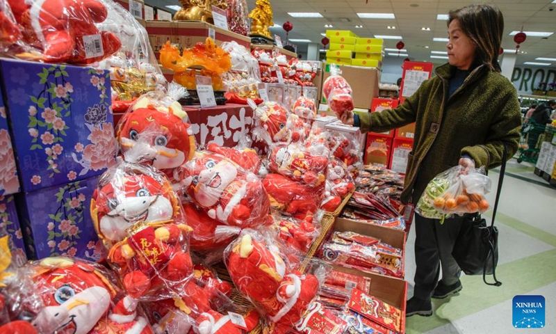 A customer shops for the upcoming Chinese Lunar New Year at a supermarket in Richmond, British Columbia, Canada, on Jan. 23, 2024.(Photo: Xinhua)