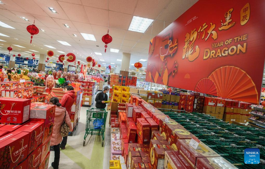 Customers shop for the upcoming Chinese Lunar New Year at a supermarket in Richmond, British Columbia, Canada, on Jan. 23, 2024.(Photo: Xinhua)
