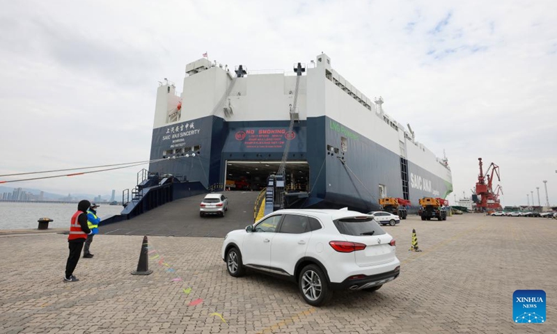 Vehicles to be exported move into SAIC Anji Sincerity ro-ro ship at Dongdu port area in Xiamen, southeast China's Fujian Province, Jan. 23, 2024. More than 3,700 cars were loaded into the ro-ro ship at Dongdu port area in Xiamen on Tuesday. The ship will depart from Xiamen on January 24 for Europe, which will be the largest batch of automobile export by far from Xiamen Port on a single voyage.(Photo: Xinhua)