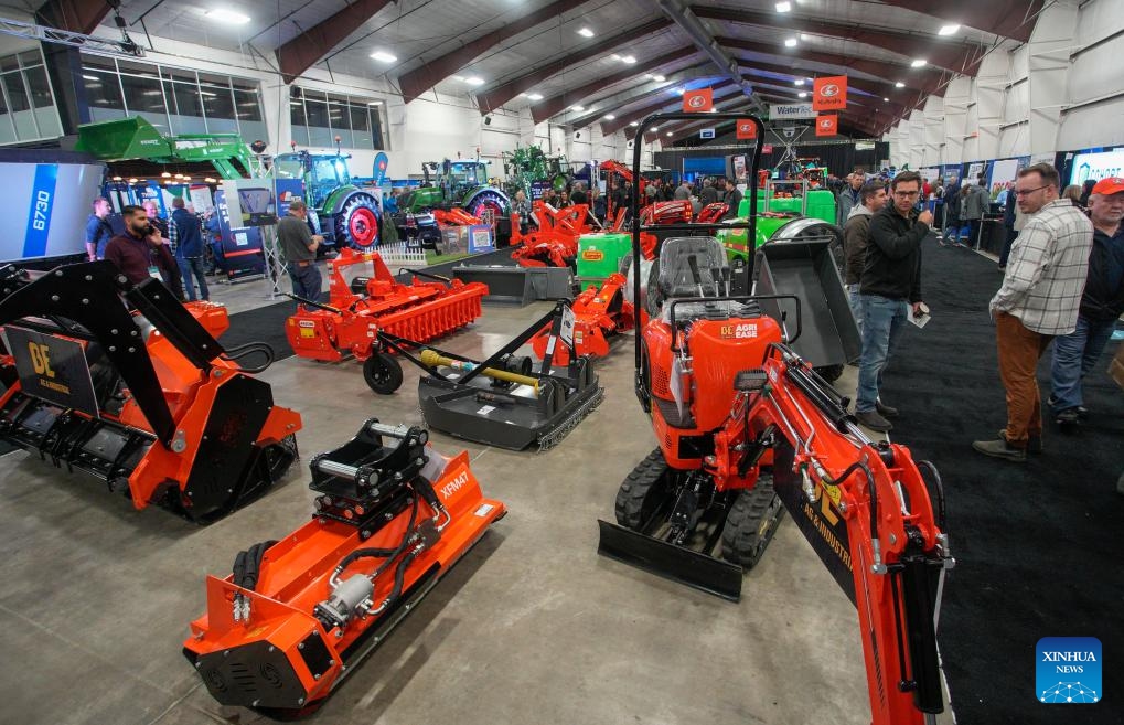 Farm machinery and equipment are displayed during the Pacific Agriculture Show in Abbotsford, British Columbia, Canada, on Jan. 25, 2024. The 26th annual Pacific Agricultural Show runs from Jan. 25 to 27 in Abbotsford, Canada. More than 300 exhibitors showcase the latest equipment and technology for the agriculture industry, attracting thousands of farmers and producers.(Photo: Xinhua)
