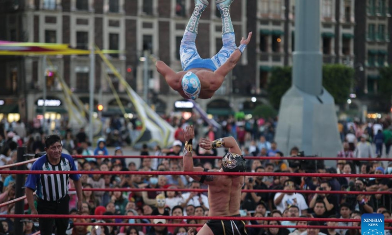 Wrestlers participate in a wrestling show at the Zocalo Square in Mexico City, Mexico on Jan. 26, 2024. (Photo by Francisco Canedo/Xinhua)