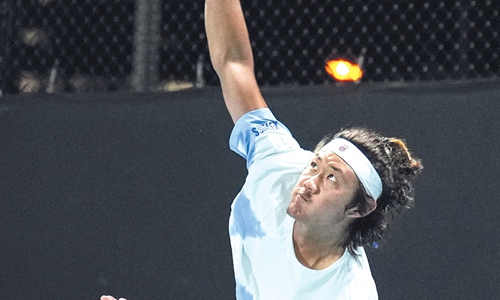 Zhang Zhizhen serves in the Men's Singles Second Round match during Australian Open in Melbourne on January 18, 2024. Photo: VCG